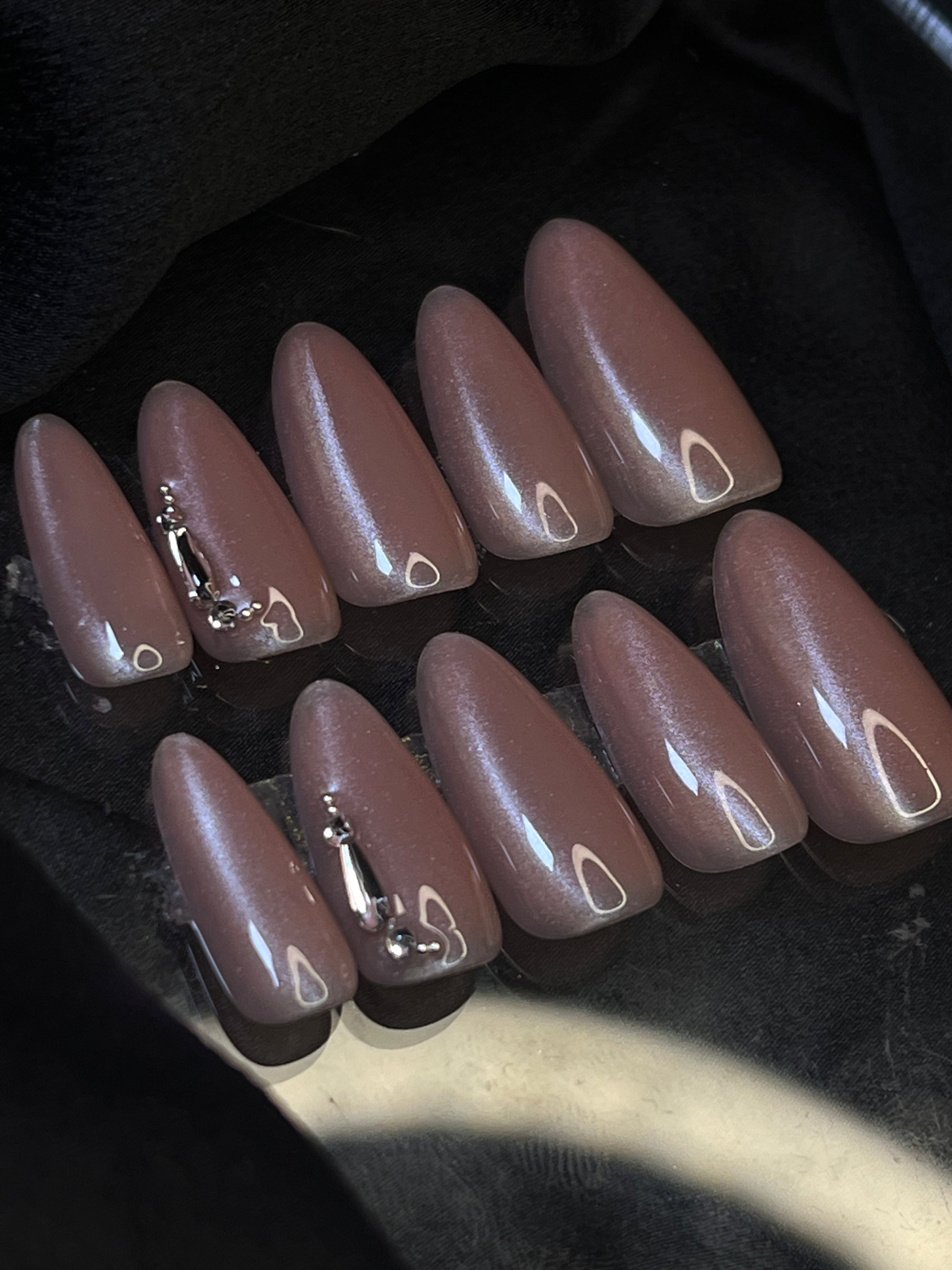 Close-up of Barely Nude Luxe Press-on Nails - Nude-toned nails with shimmer and embellishments, ideal for sarees, casual, and office wear.